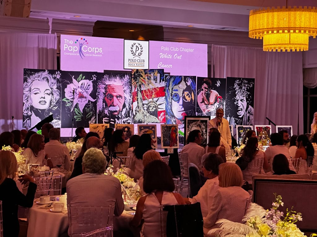 The Pap Corps Polo Club chapter White Out Cancer gala at Boca Polo Club, Michael Israel's canvases lining the stage before a full ballroom