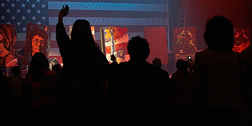 Michael Israel performing for a patriotic-themed audience