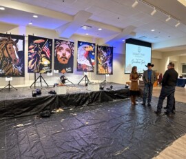 Stage with five Michael Israel paintings before the Guardians Gala