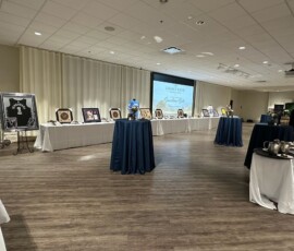 Silent auction tables set up in the Guardians Gala ballroom